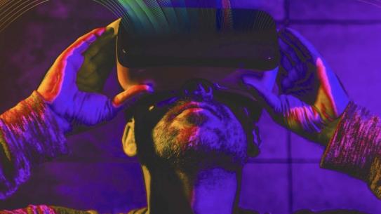 stylized image of man staring into VR headset