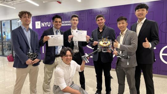 group of male students displaying winning capstone project