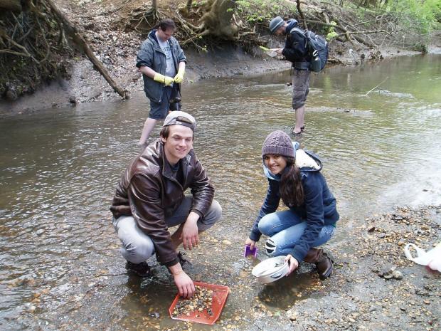 SUE students testing water quality in a creek