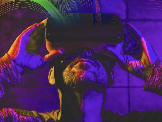stylized image of man staring into VR headset