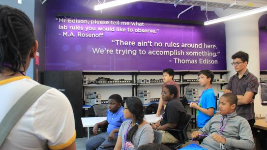 students listening to a lab tour