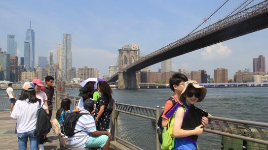 students performing experiments underneath the Brooklyn Bridge 