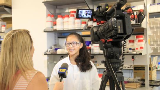 student being interviewed in a lab 
