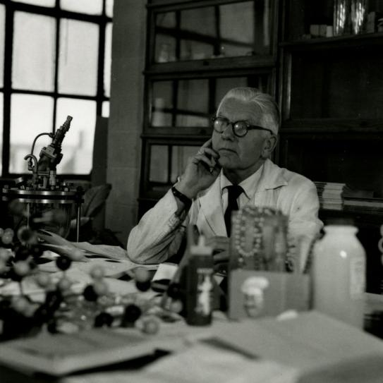black and white photo of Herman Mark sitting at his desk
