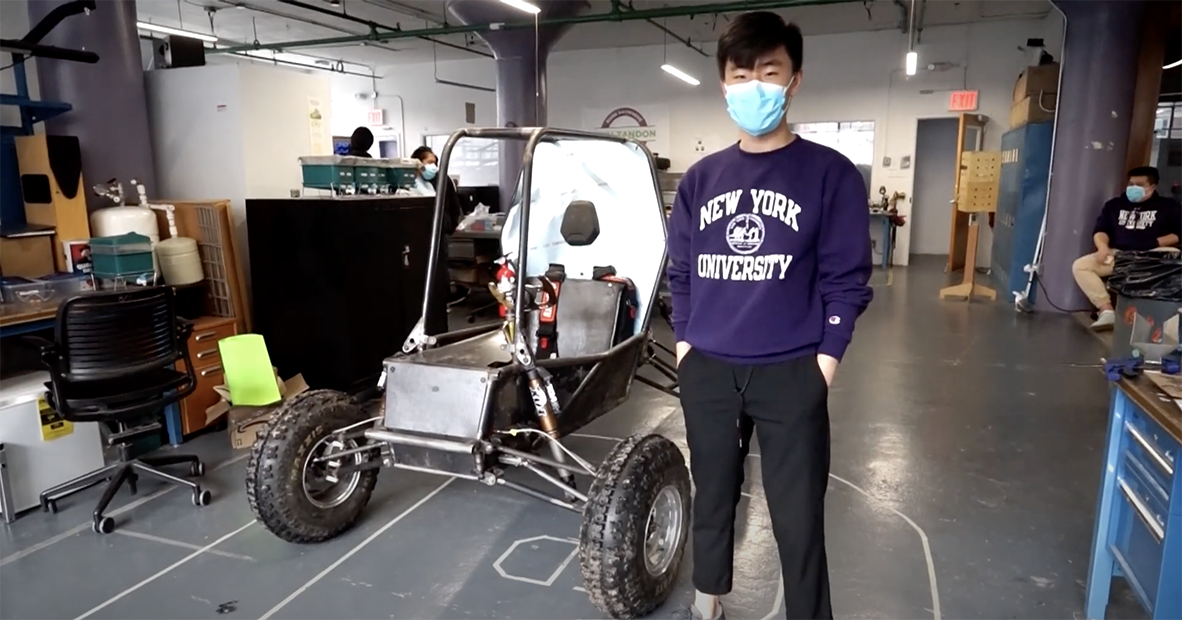 Students standing in front of a buggy built by the VIP team.